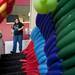 Tim Thurmond walks next to his balloon dragon structure at the Marriott on Sunday. The money raised to stomp on the dragon is donated to the Education Project for Homeless Youth. Thurmond says its rewarding to see both young and old people enjoy the experience. "I'm glad I did it, It's been fun" he says.  Daniel Brenner I AnnArbor.com